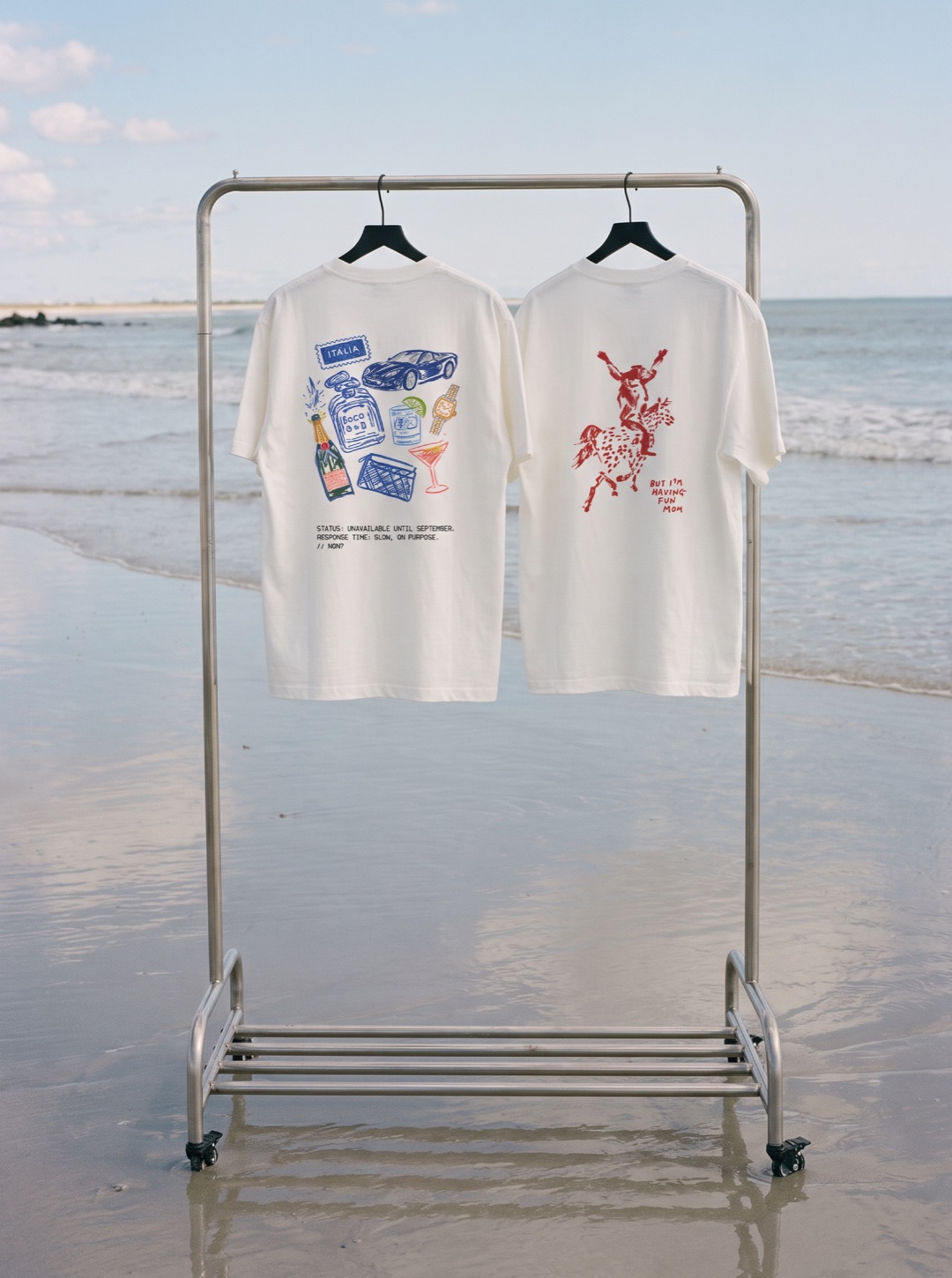 Bocoeur graphic tees on a rack at the beach